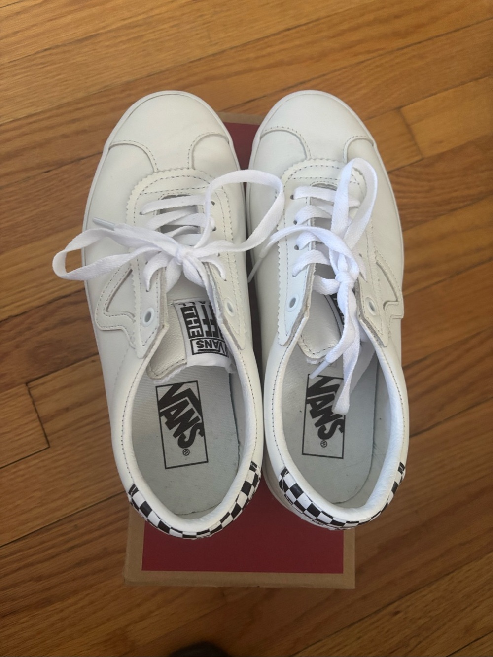 Vans White Low-Top Sneakers with Black Checker Heel Accent